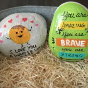 Painted rocks with encouraging messages like "You are amazing. You are brave. You are strong."